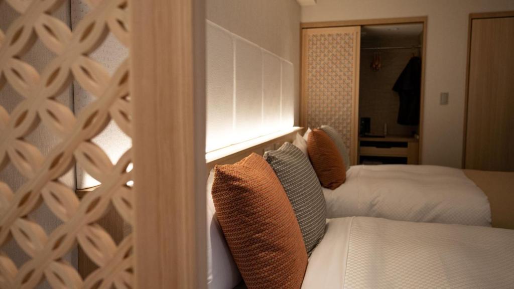 Postel nebo postele na pokoji v ubytování Kinugawa Onsen Hotel