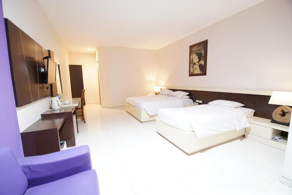 Postel nebo postele na pokoji v ubytování Hotel New Puri Garden