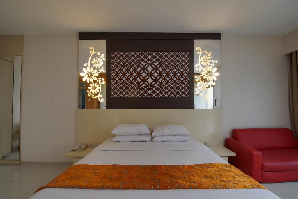 Postel nebo postele na pokoji v ubytování Hotel New Puri Garden