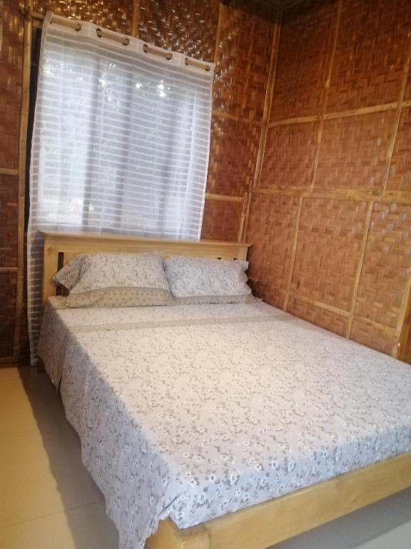 Postel nebo postele na pokoji v ubytování Almare Guest House Siquijor