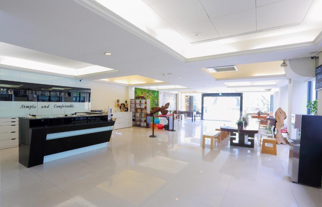 a large room with a piano in the middle of it at Huang Shin Business Hotel-Chung Kang in Taichung