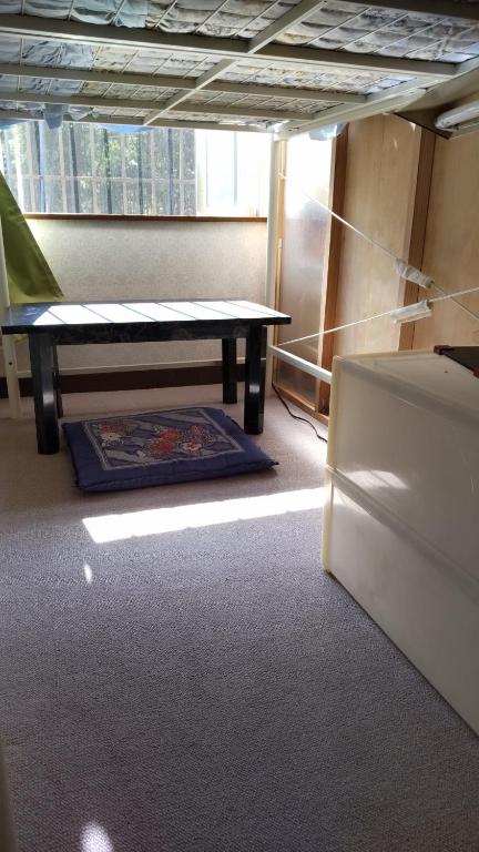 Postel nebo postele na pokoji v ubytování Guesthouse Oomiya base 大宮基地別荘