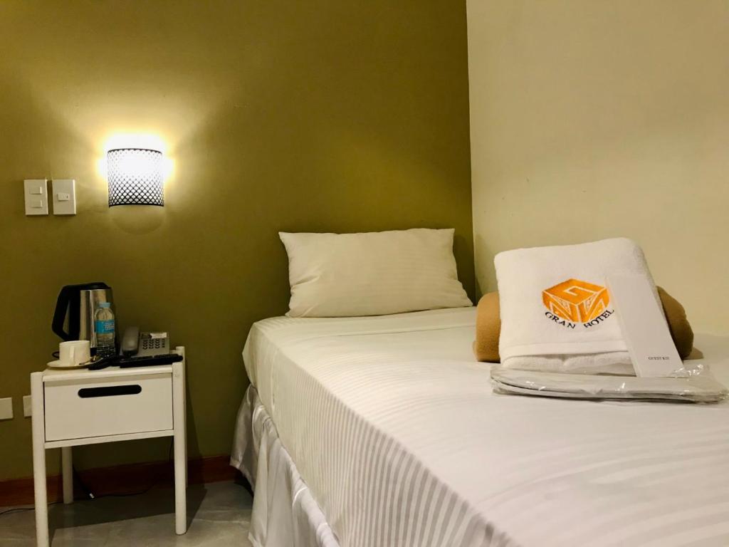 Postel nebo postele na pokoji v ubytování NGN Gran Hotel