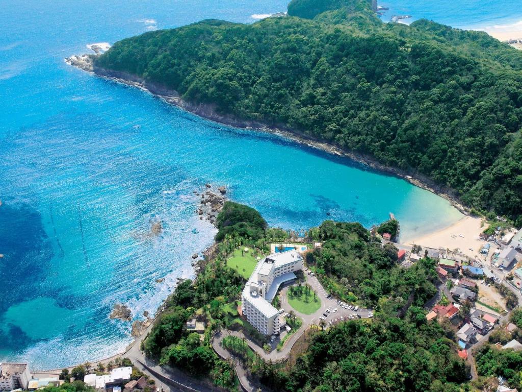 an aerial view of a beach next to the ocean at Shimoda Tokyu Hotel in Shimoda