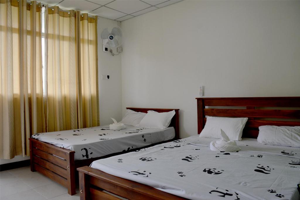 Postel nebo postele na pokoji v ubytování Paramata Accommodation