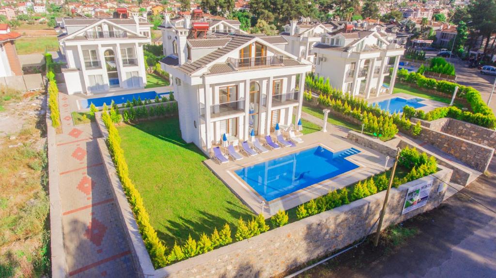 an aerial view of a house with a swimming pool at Silver Sami Villa, Özel Havuzlu, Fethiye, in Fethiye