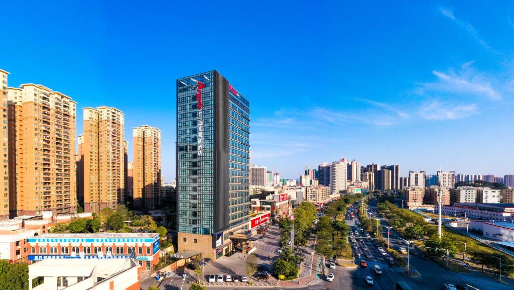 a view of a city with a tall building at Qingyuan Argyle Hotel in Qingyuan