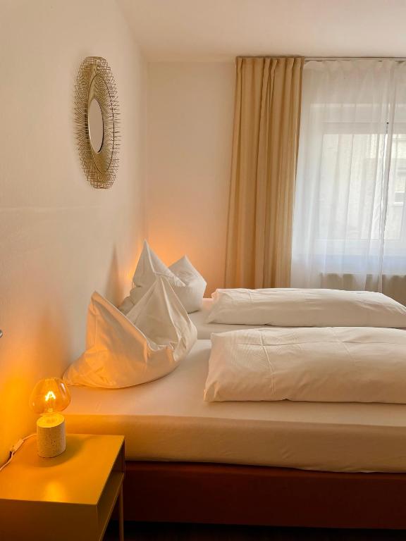 Postel nebo postele na pokoji v ubytování Hotel Berg