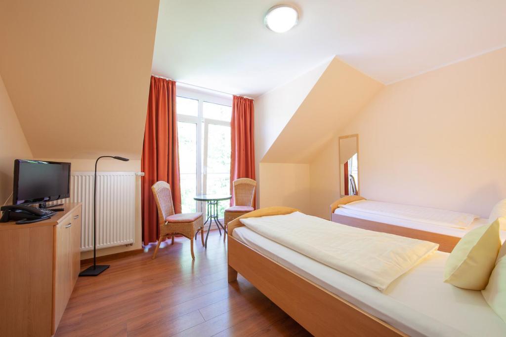 Postel nebo postele na pokoji v ubytování Heidsmühle