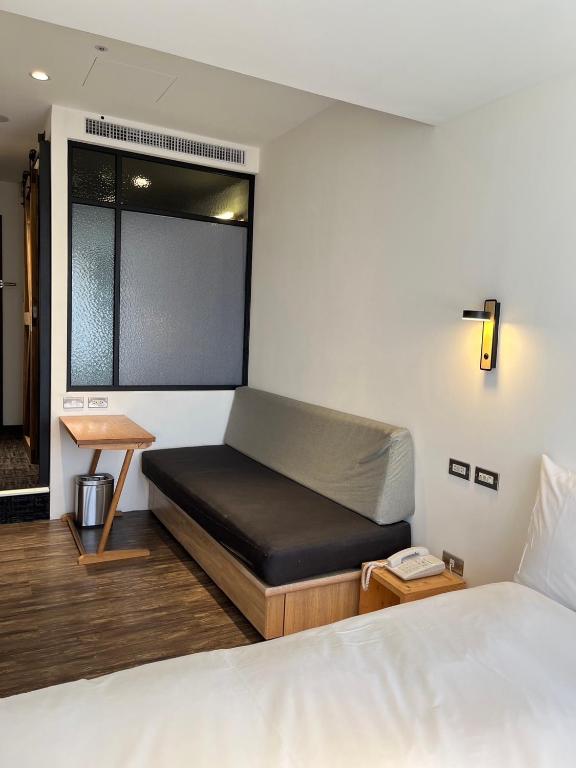 A bed or beds in a room at NK Hostel