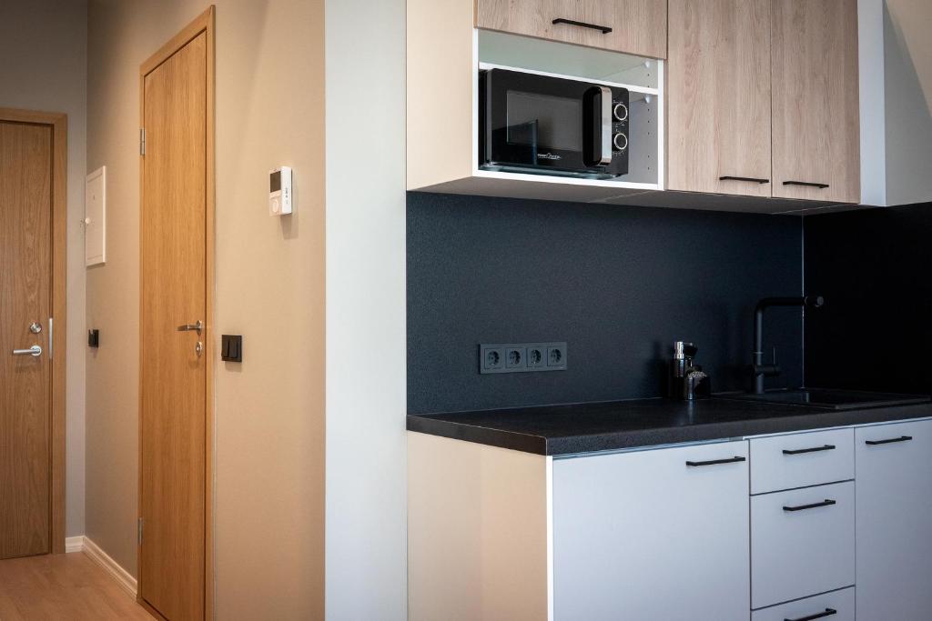 Kuchyň nebo kuchyňský kout v ubytování Espak Hostel