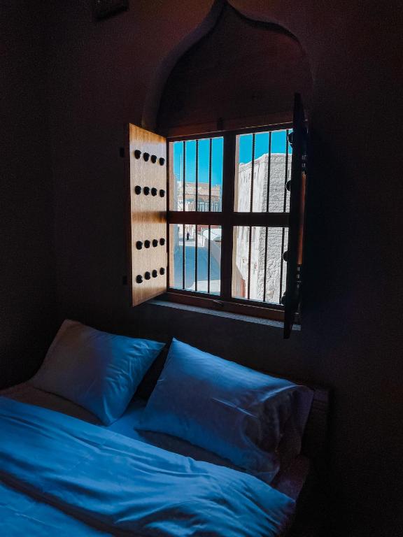 Postel nebo postele na pokoji v ubytování Alaqur View Inn نزل واجهة العقر