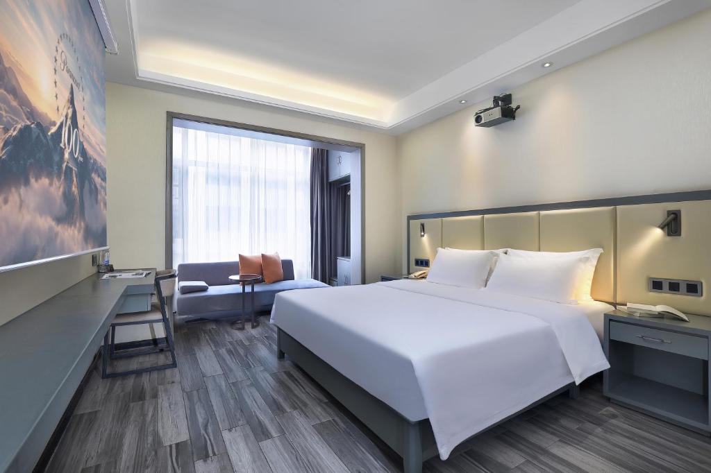 Postel nebo postele na pokoji v ubytování Wing Hotel Guilin - Central Square