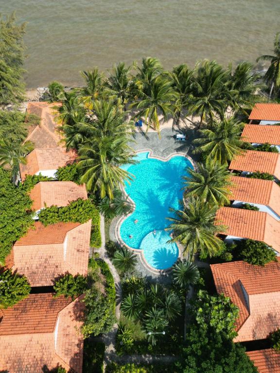 an aerial view of a resort with a swimming pool at Wildland Resort in Phú Quốc