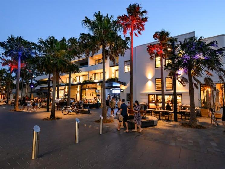 a group of people walking in front of a building at Eloura Gardens 100m to Beach in Cronulla