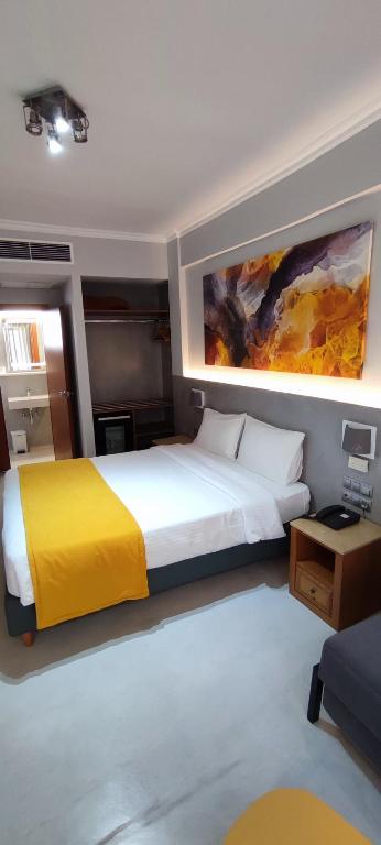 A bed or beds in a room at Poseidonio