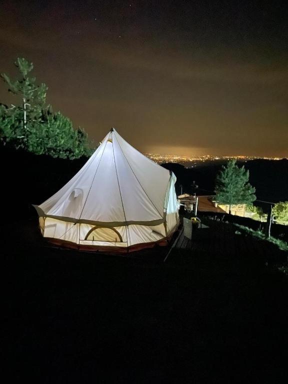 a white tent sitting on top of a field at Agriturismo La Taverna in Fontanelice