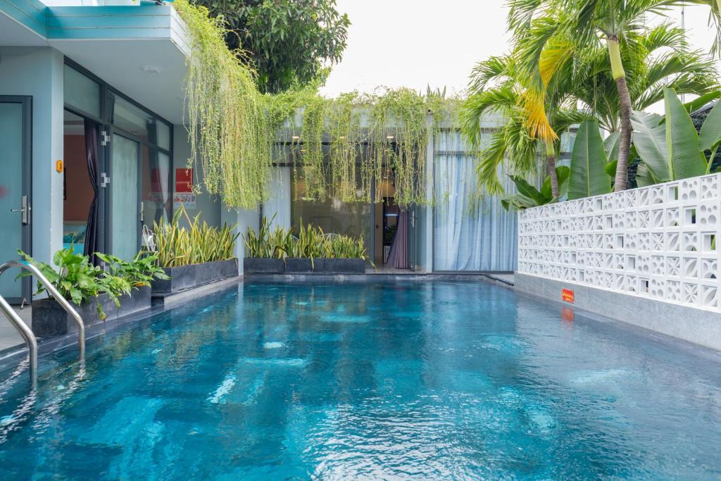 a swimming pool in the middle of a house at Sea House Hotels and Apartments in Vung Tau