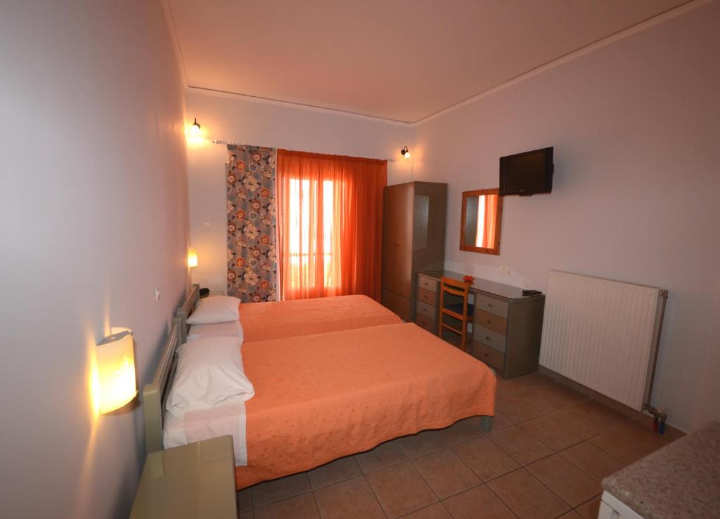 A bed or beds in a room at Konstantza Studios and Apartments