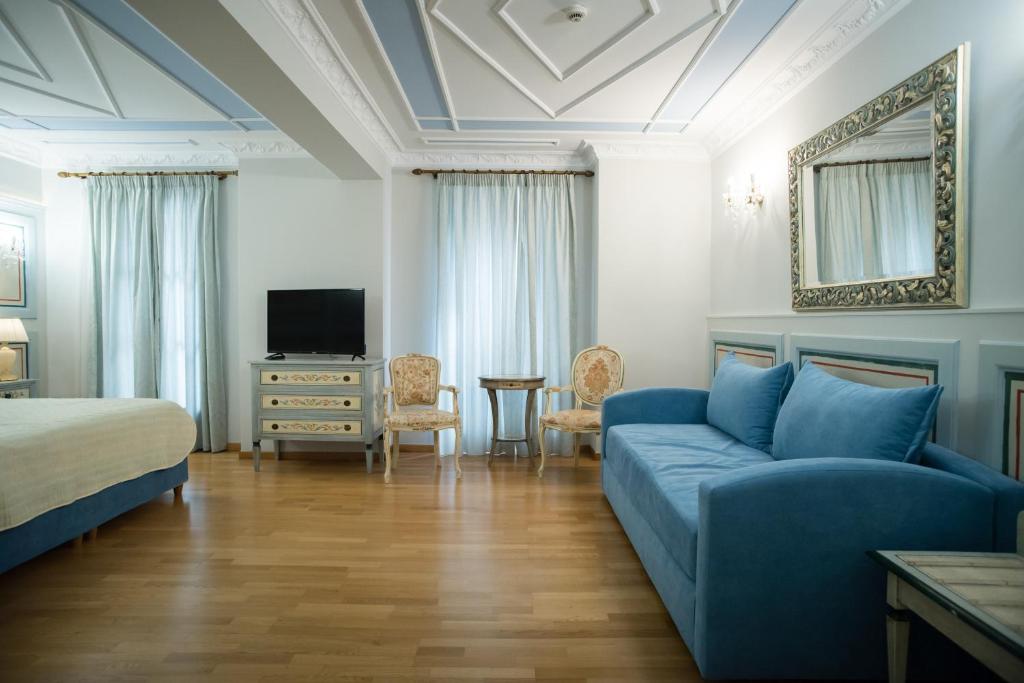 TV a/nebo společenská místnost v ubytování Byzantino Hotel
