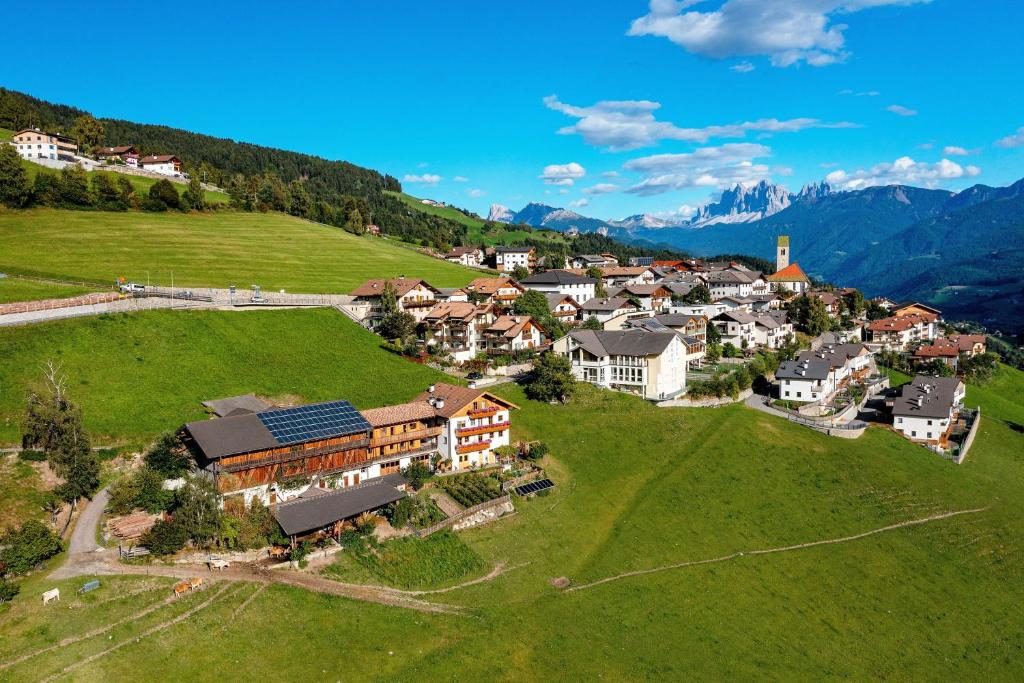 an aerial view of a small town on a green field at Thalhofer Hof in Lazfons