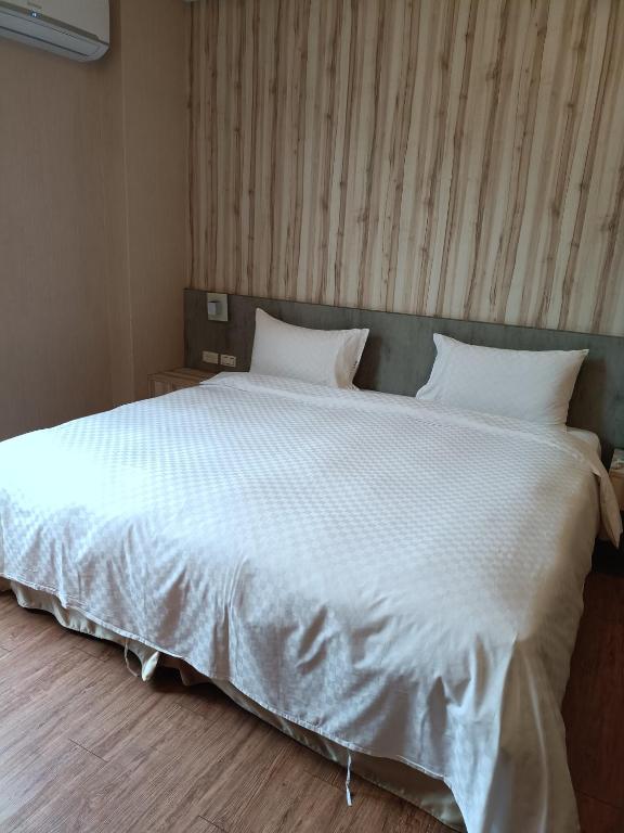 Voodi või voodid majutusasutuse Fu Yu Spring House toas