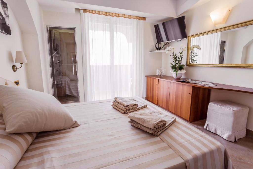 Postel nebo postele na pokoji v ubytování Hotel Derby Exclusive