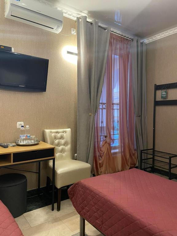TV a/nebo společenská místnost v ubytování Hotel Afrodita