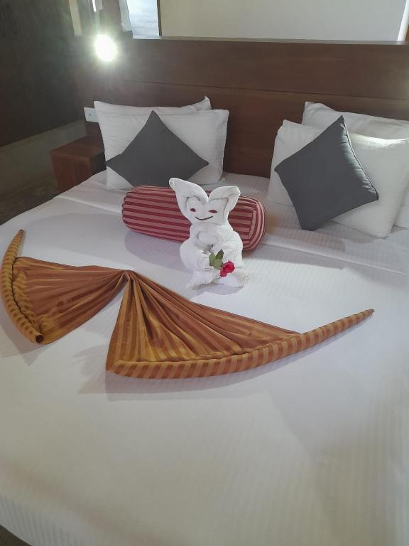 Postel nebo postele na pokoji v ubytování Aloft Grand Hotel Ella