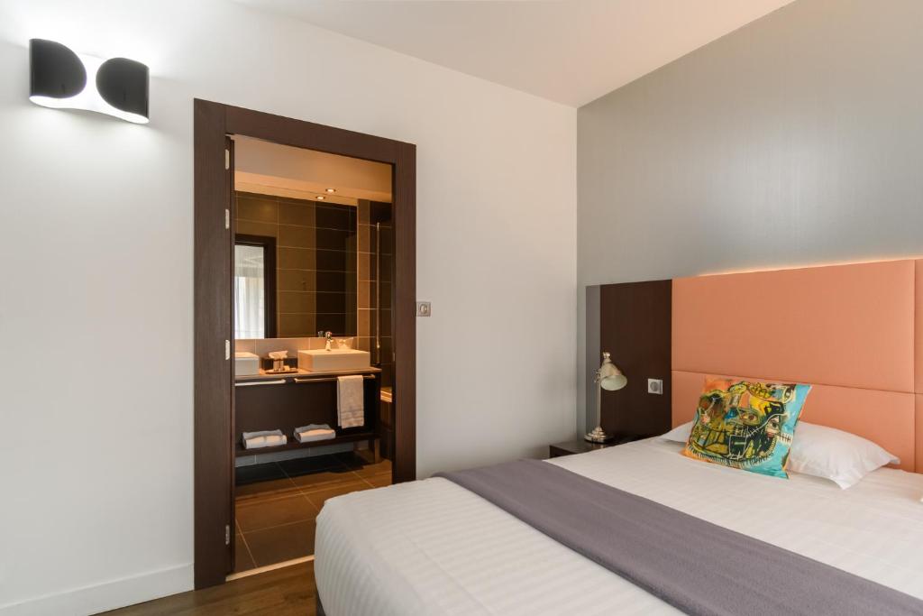 Postel nebo postele na pokoji v ubytování Hype Hôtel
