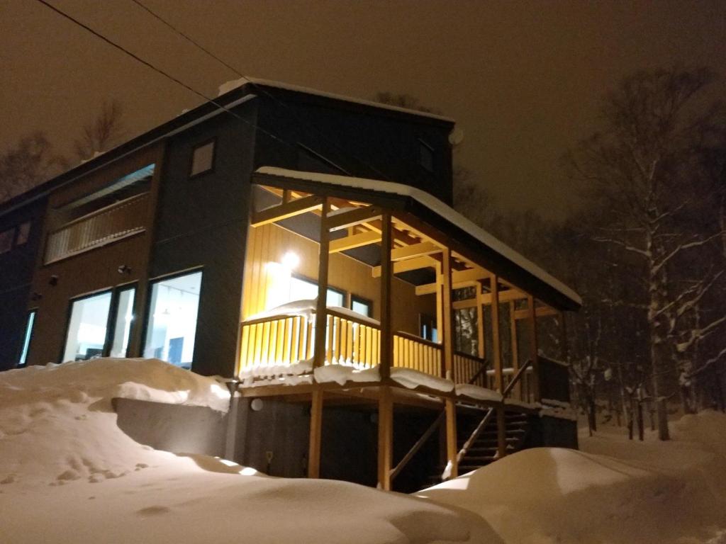 a cabin in the snow at night at CLOUD9 - Vacation STAY 46105v in Rusutsu