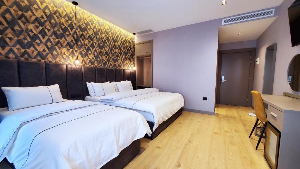 Letto o letti in una camera di StarLight Hotel