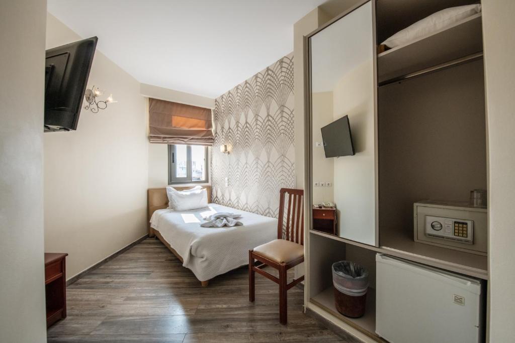 TV a/nebo společenská místnost v ubytování Athens Golden City Hotel