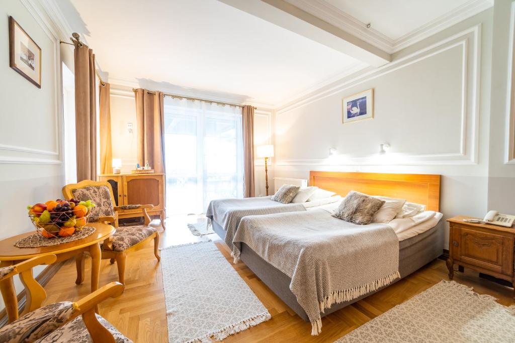 Posteľ alebo postele v izbe v ubytovaní Hotel Solar Palace SPA & Wellness