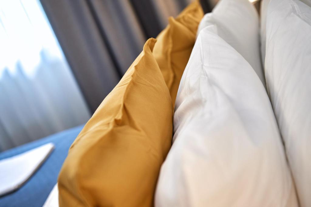 Postel nebo postele na pokoji v ubytování La Maison