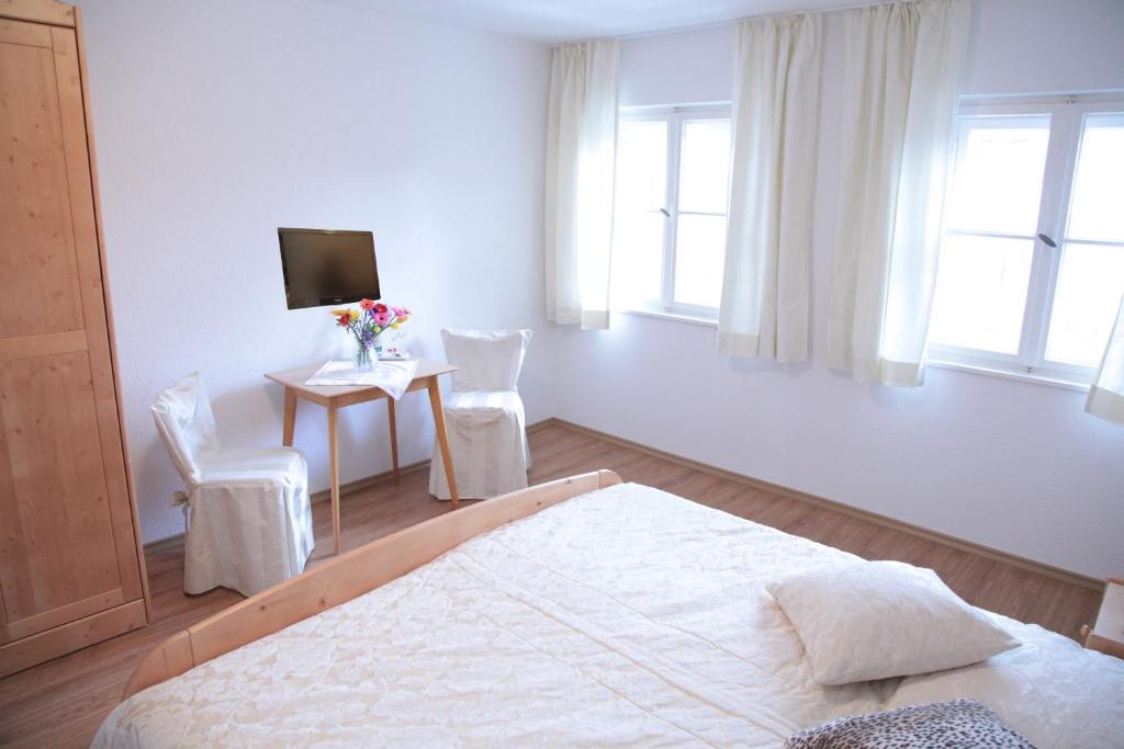 Postel nebo postele na pokoji v ubytování Hotel Garni Georgenhof Adults Only