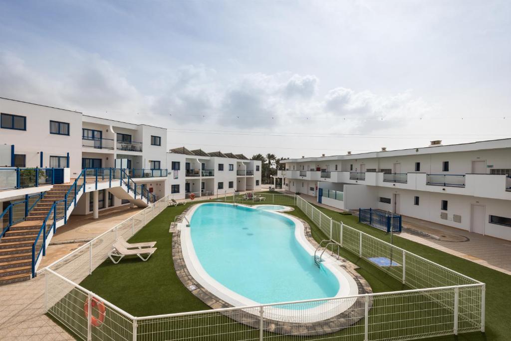 Bazén v ubytování Home2Book Aloha Palm nebo v jeho okolí