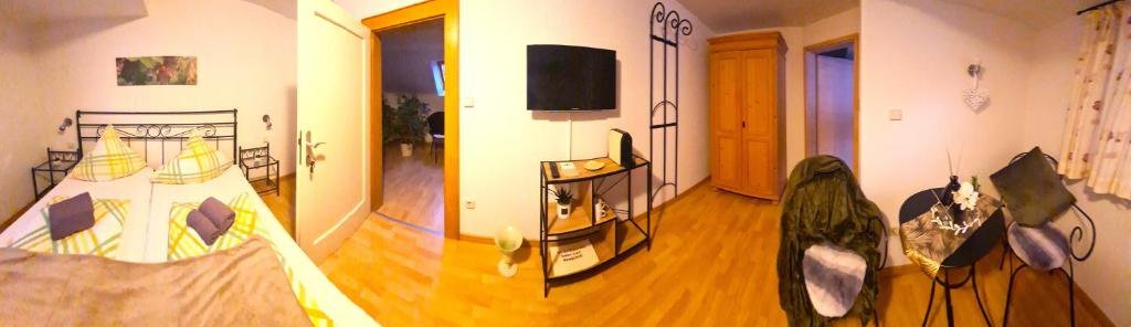 Postel nebo postele na pokoji v ubytování Gästehaus Zum Weinbauer