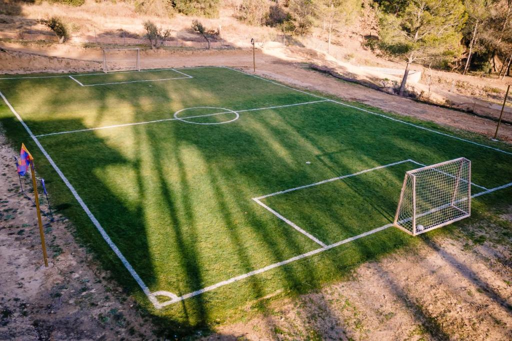 an aerial view of a soccer field with a net at VILLA CHETRUS Casa en plena naturaleza in Barcelona