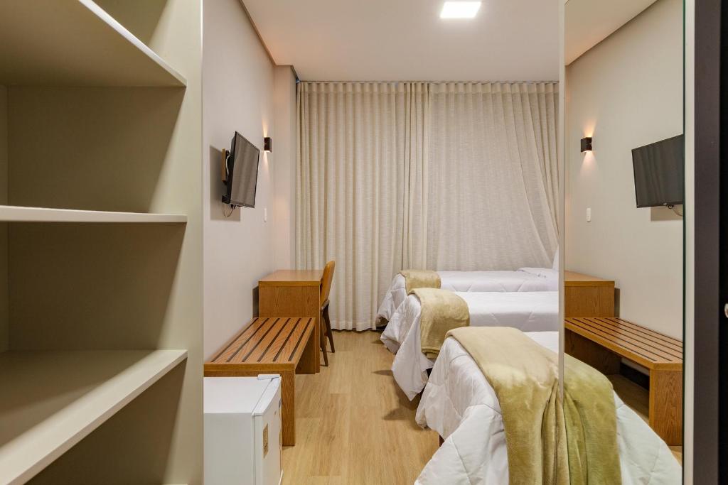 Postel nebo postele na pokoji v ubytování Tri Hotel Antônio Prado