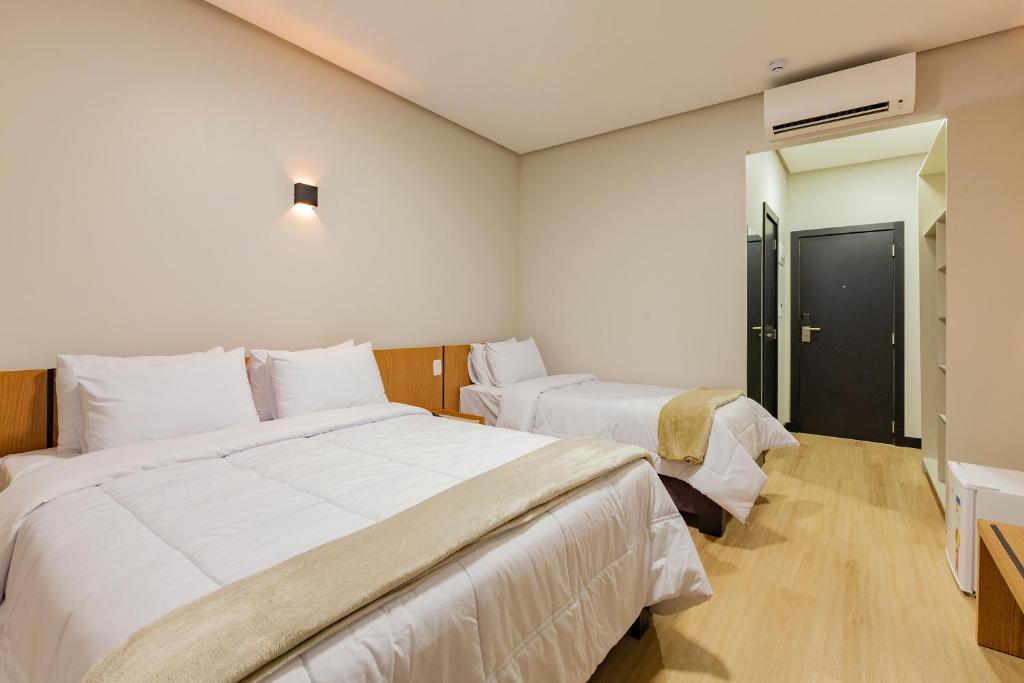 Postel nebo postele na pokoji v ubytování Tri Hotel Antônio Prado