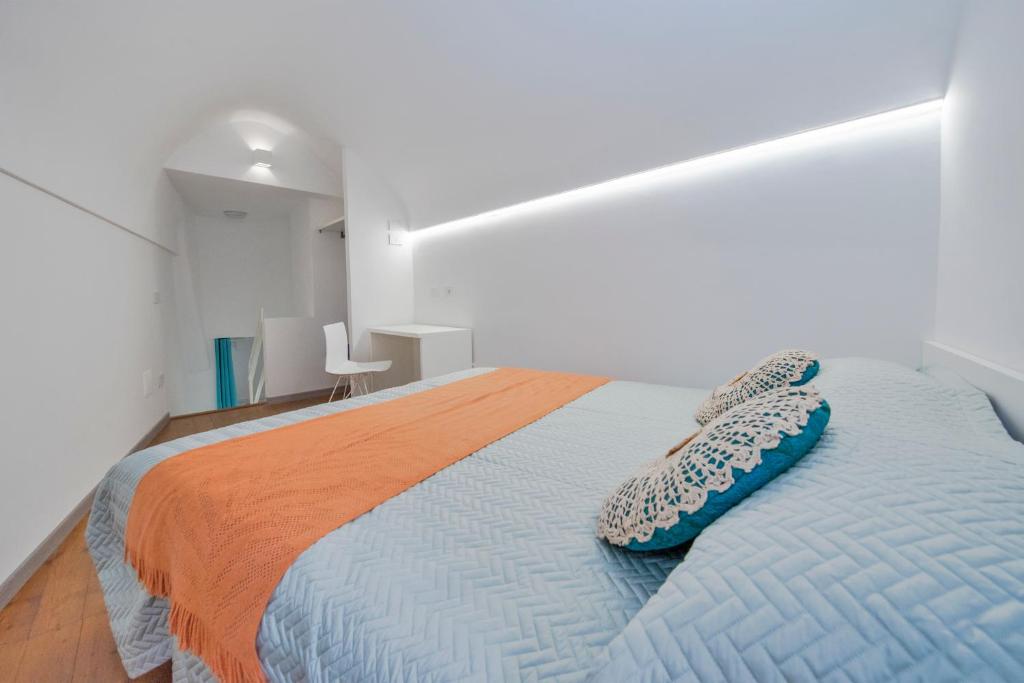A bed or beds in a room at Piccolo Scrigno