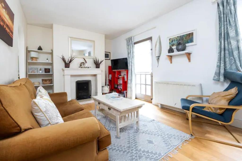 a living room with a couch and a table at Artist's CENTRAL apartment! in Dublin