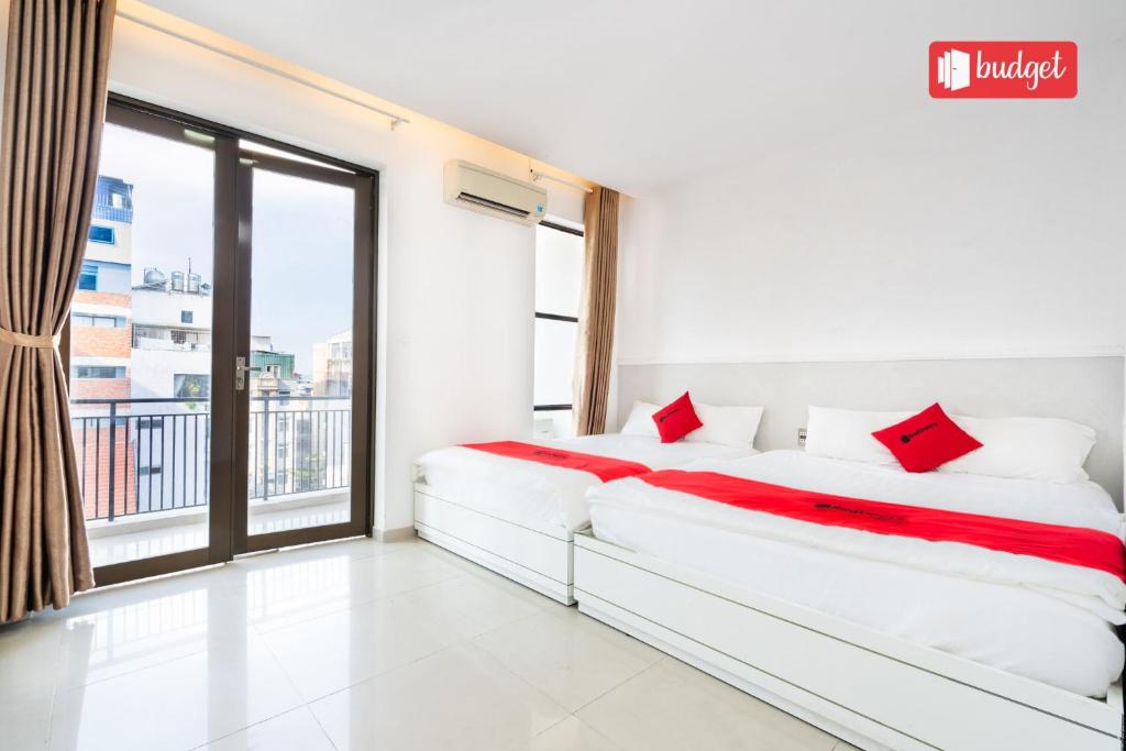 Postel nebo postele na pokoji v ubytování Khanh Linh Hotel
