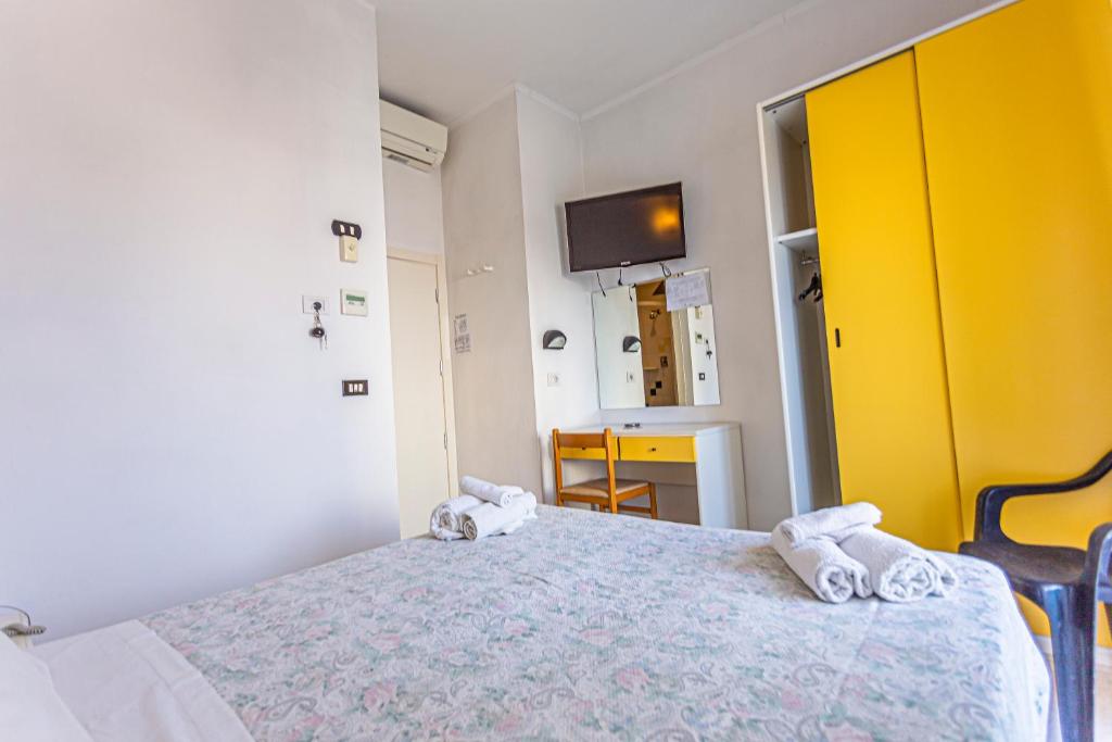 Postel nebo postele na pokoji v ubytování Hotel Continental