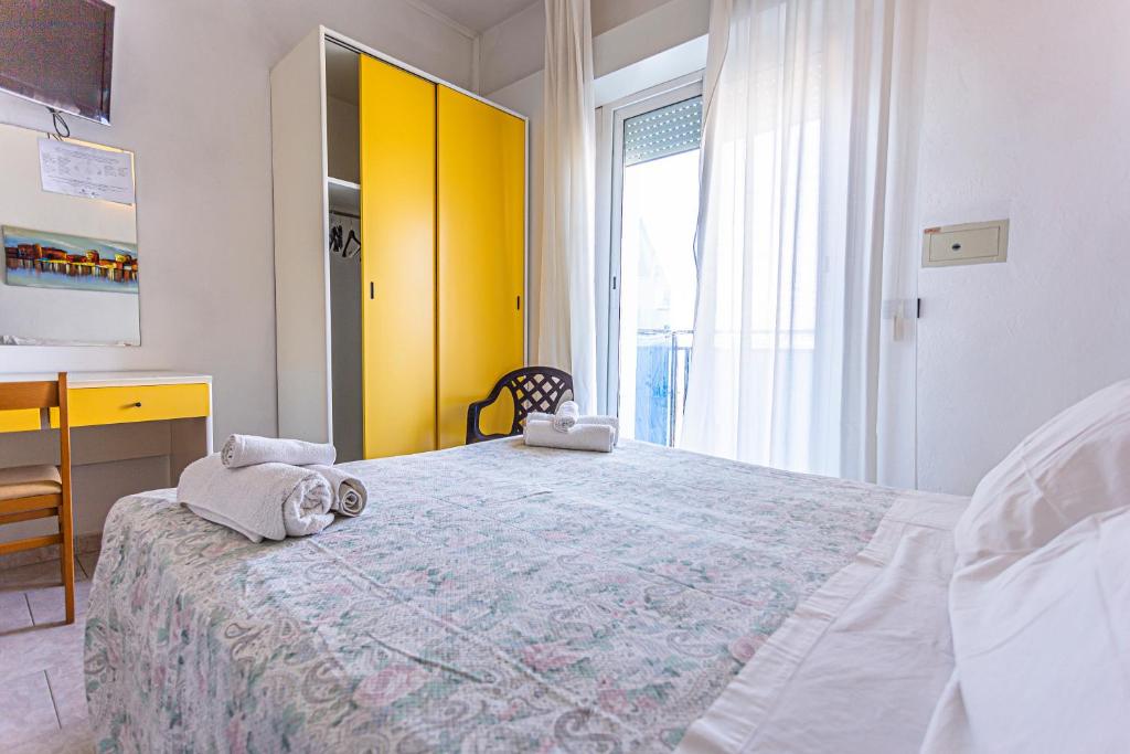 Postel nebo postele na pokoji v ubytování Hotel Continental