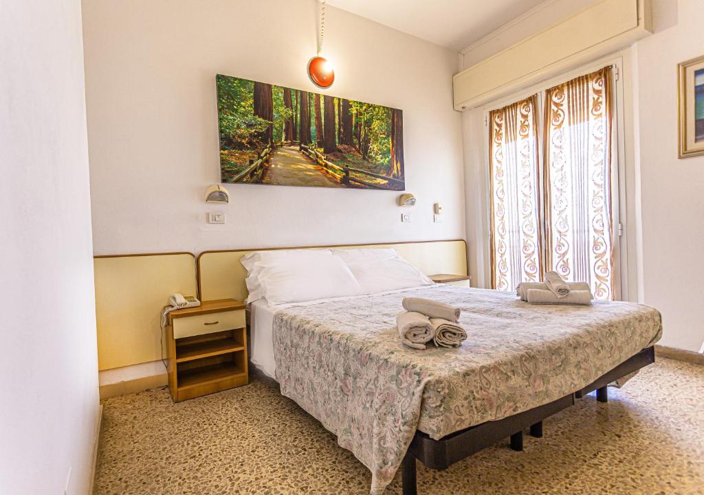 Postel nebo postele na pokoji v ubytování Hotel Continental
