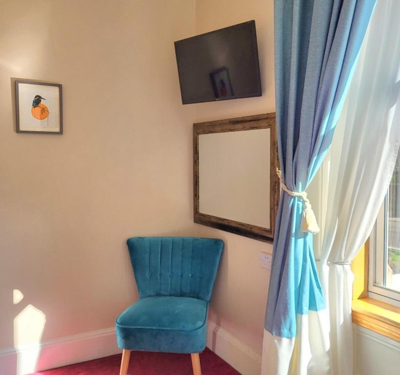 TV a/nebo společenská místnost v ubytování Straven Guesthouse