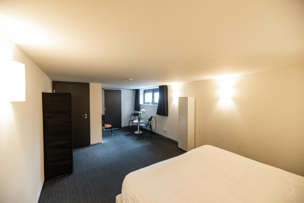 Postel nebo postele na pokoji v ubytování Smart Bnb - Appart Hotel Battice