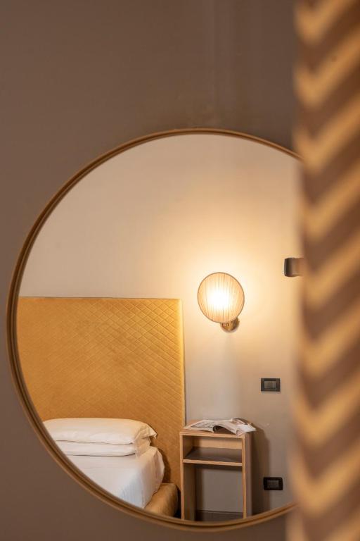 Postel nebo postele na pokoji v ubytování Hotel Milani